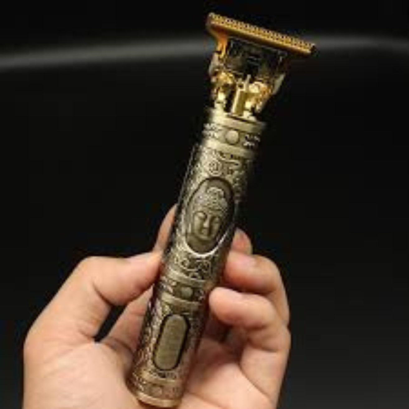 Detailed engraving, texture, and gold finish.